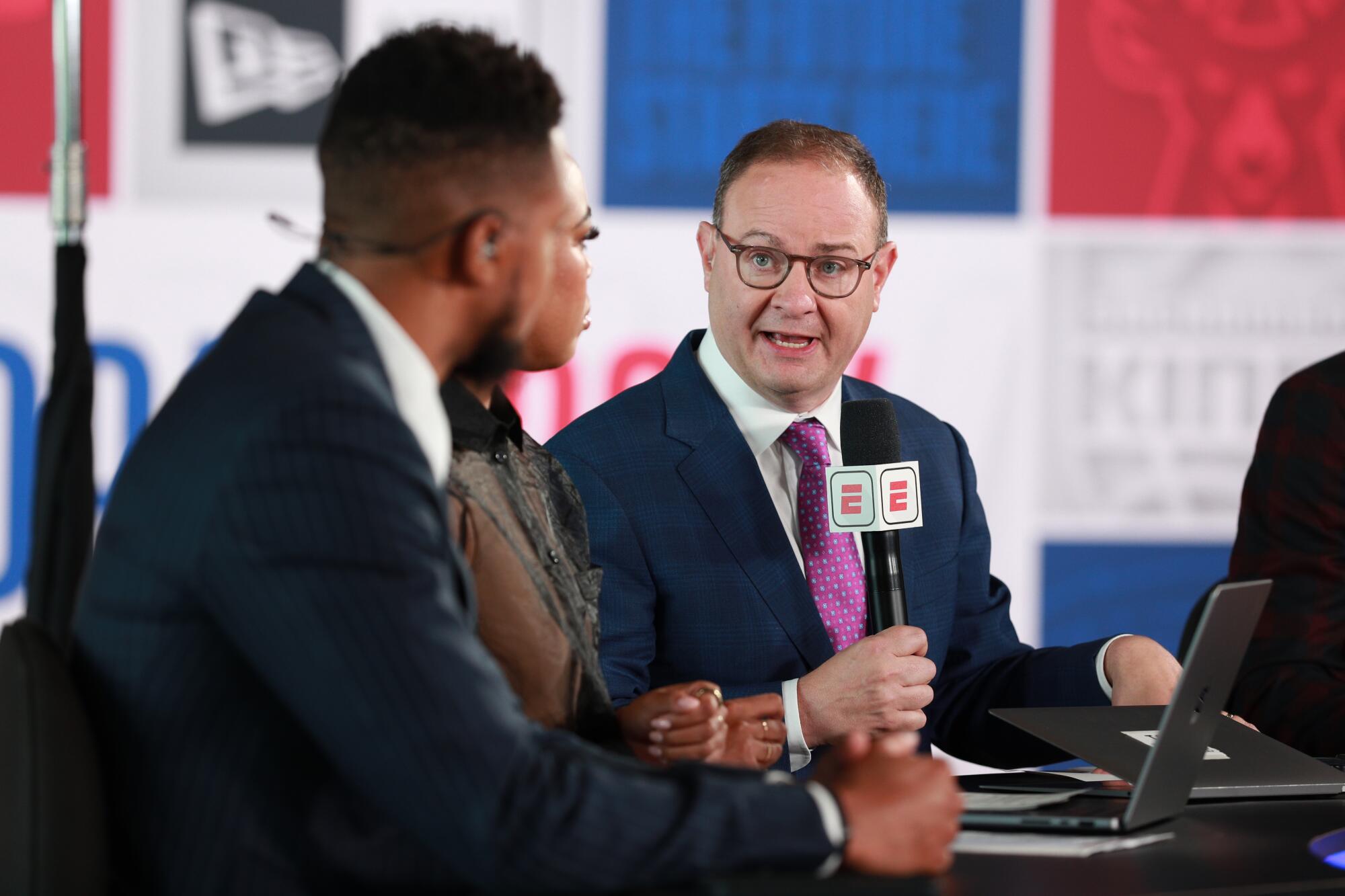 Adrian Wojnarowski speaks during the NBA draft with other ESPN broadcasters