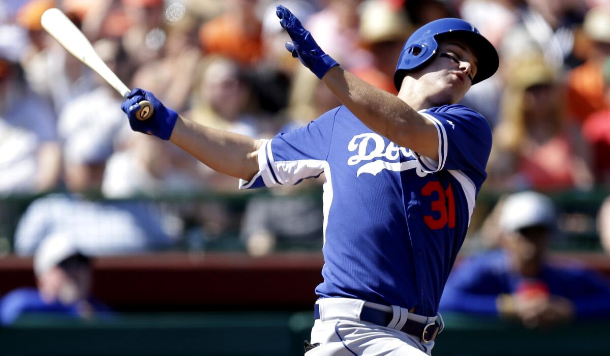 Dodgers outfielder Joc Pederson fouls off a ball during a spring training game on March 9.