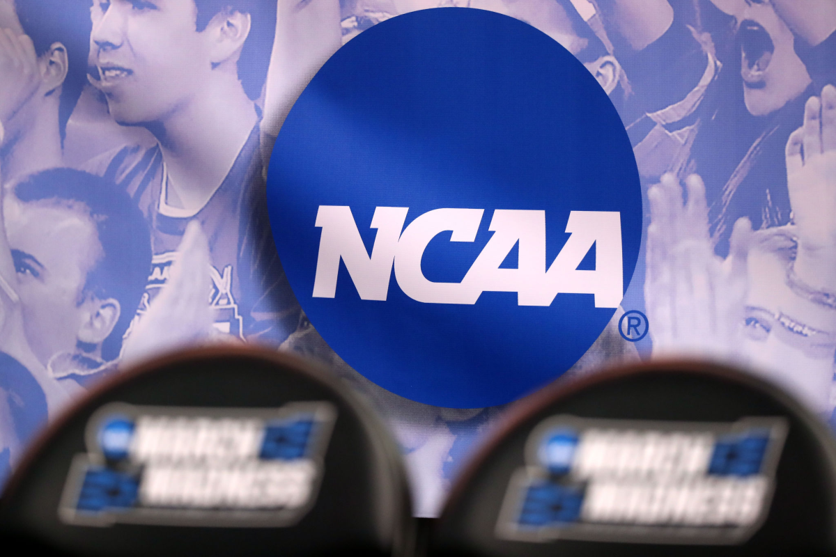 The NCAA logo courtside at a March Madness basketball game