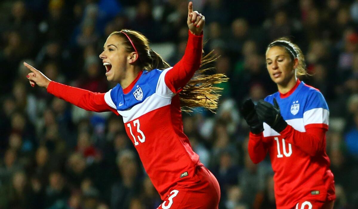 U.S. forward Alex Morgan celebrates after scoring against England in an exhibition game Friday night.