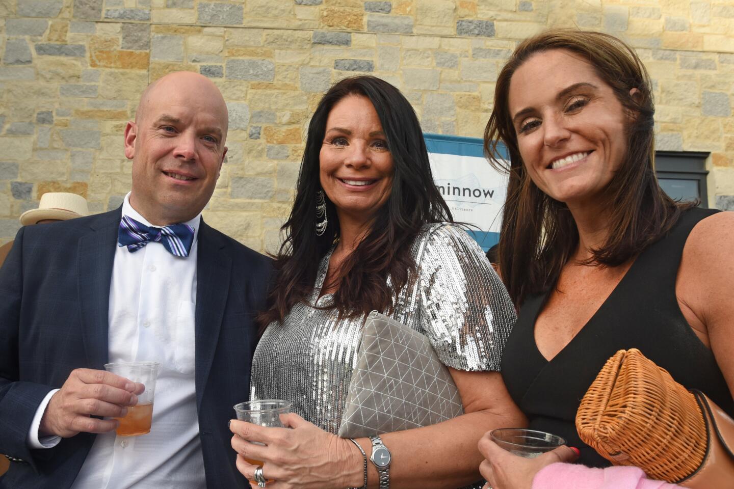 From left, Brian Messick, Betsy Brown and Katie Messick at the Bourbon and Bowties charity fundraiser held at Rye Street Tavern in Port Covington.