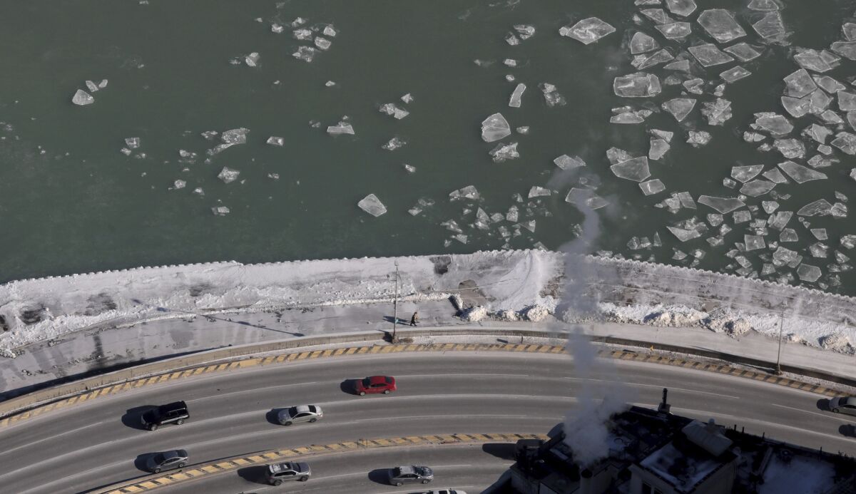 Ice forms on Lake Michigan in Chicago as an arctic blast moves into the Midwest