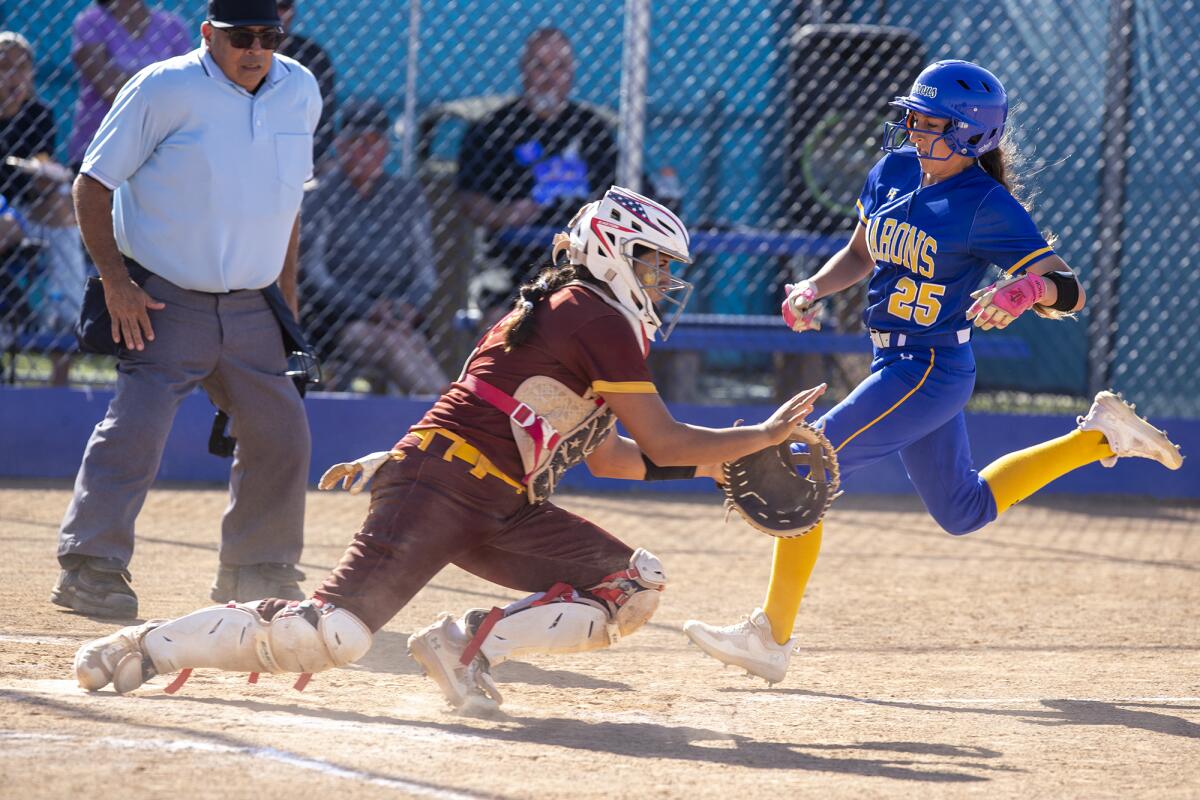 Fountain Valley's Samantha Estrada scores in the fifth inning against Barstow at Fountain Valley High School on Thursday.
