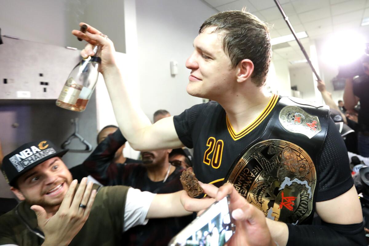 Timofey Mozgov, now a member of the Lakers, enjoys the moment after Cleveland clinched the NBA championship.