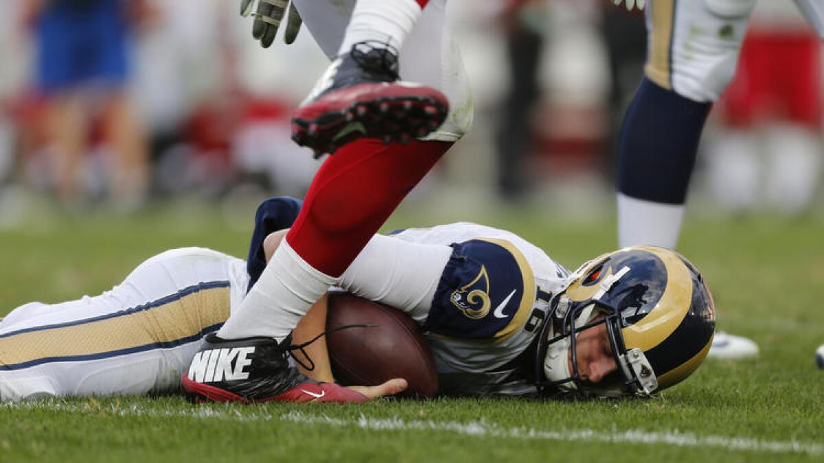 Rams quarterback Jared Goff is slow to get up after being sacked by Cardinals defensive end Calais Campbell. To see more images from the game, click on the photo above.