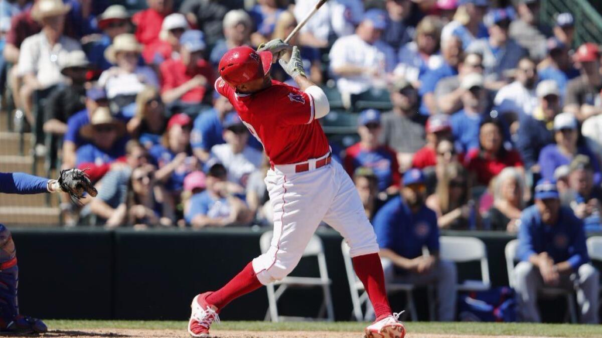 Jefry Marte of the Angels hits a home run in the second inning against the Chicago Cubs at Tempe Diablo Stadium.