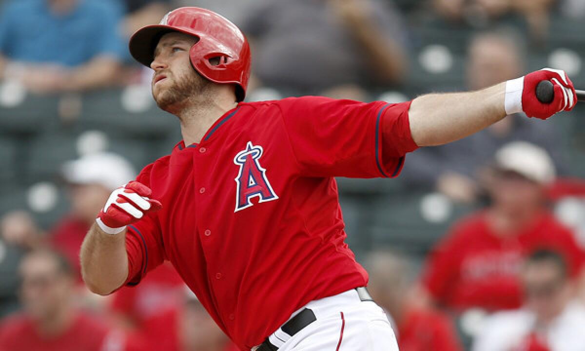 Angels catcher Chris Iannetta hits a two-run double during an exhibition game against the Chicago Cubs on Feb. 28. Iannetta was one of only two regulars to play in the Angels' Cactus League win over the Cleveland Indians on Monday.