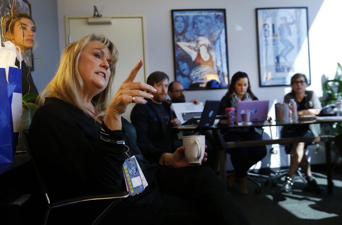 Executive producer Trish Kinane, gesturing, meets with other producers inside her office at CBS Television City in Hollywood, to discuss the hometown visits segment for "American Idol."