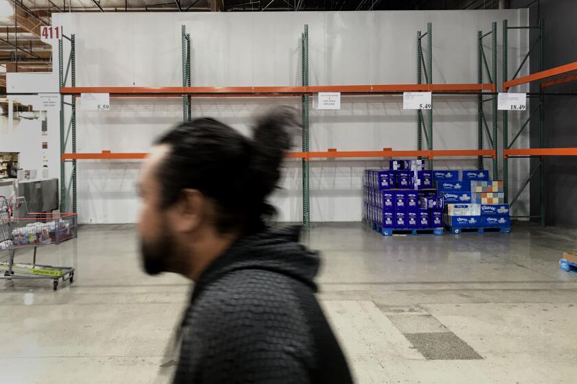 ALHAMBRA, CA - MARCH 7, 2020: Shelves for toilet paper and water are barren at Costco on March 7, 2020 in Alhambra, California. (Gina Ferazzi/Los AngelesTimes)