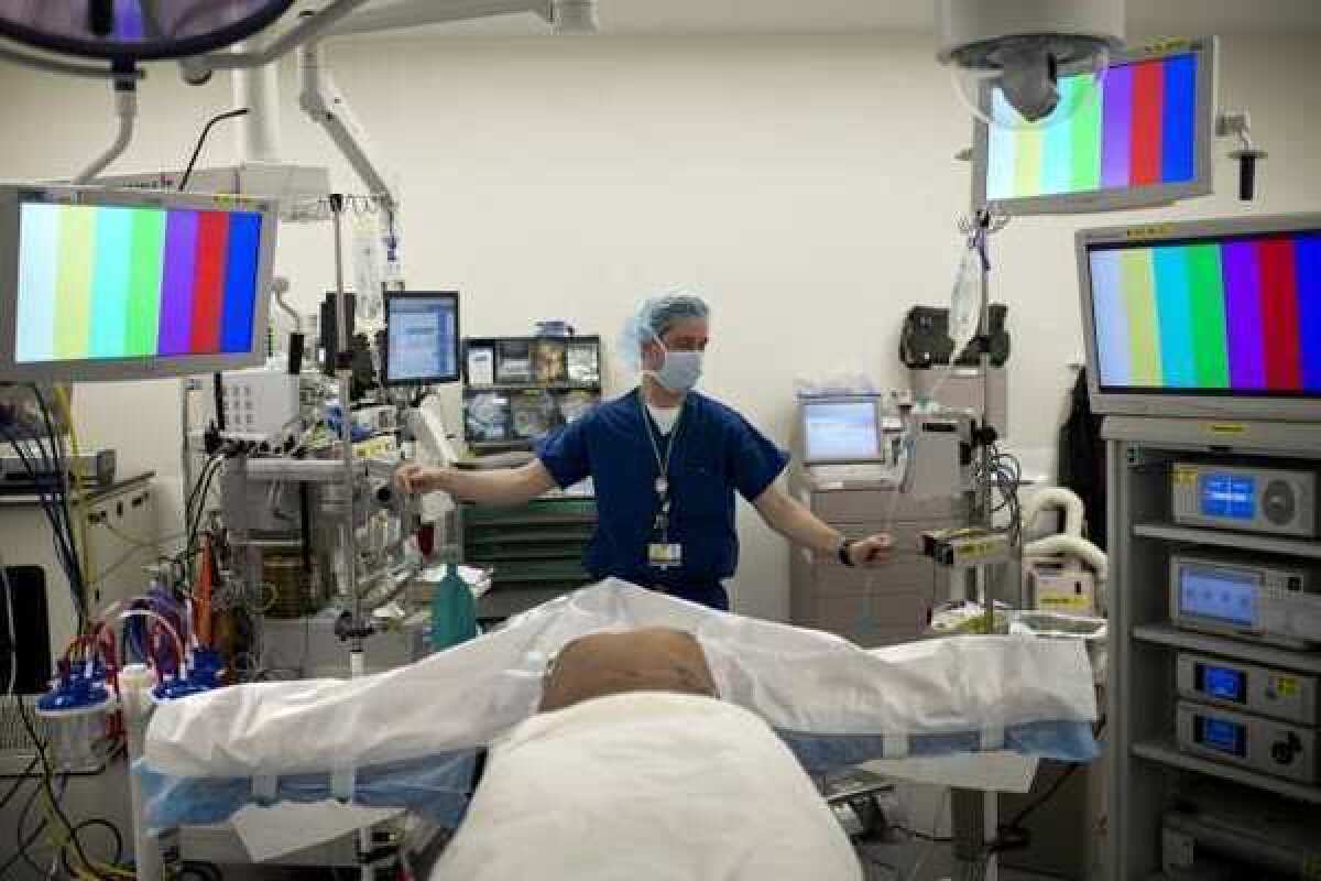 An anesthesiologist prepares a kidney donor in the operating room for a transplant at Johns Hopkins Hospital in Baltimore.