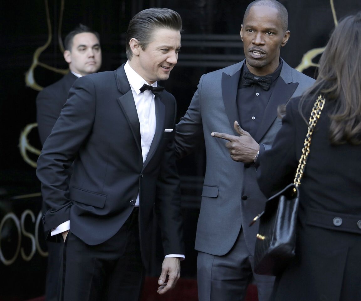 Oscars 2013 arrivals: Jeremy Renner and Jamie Foxx.
