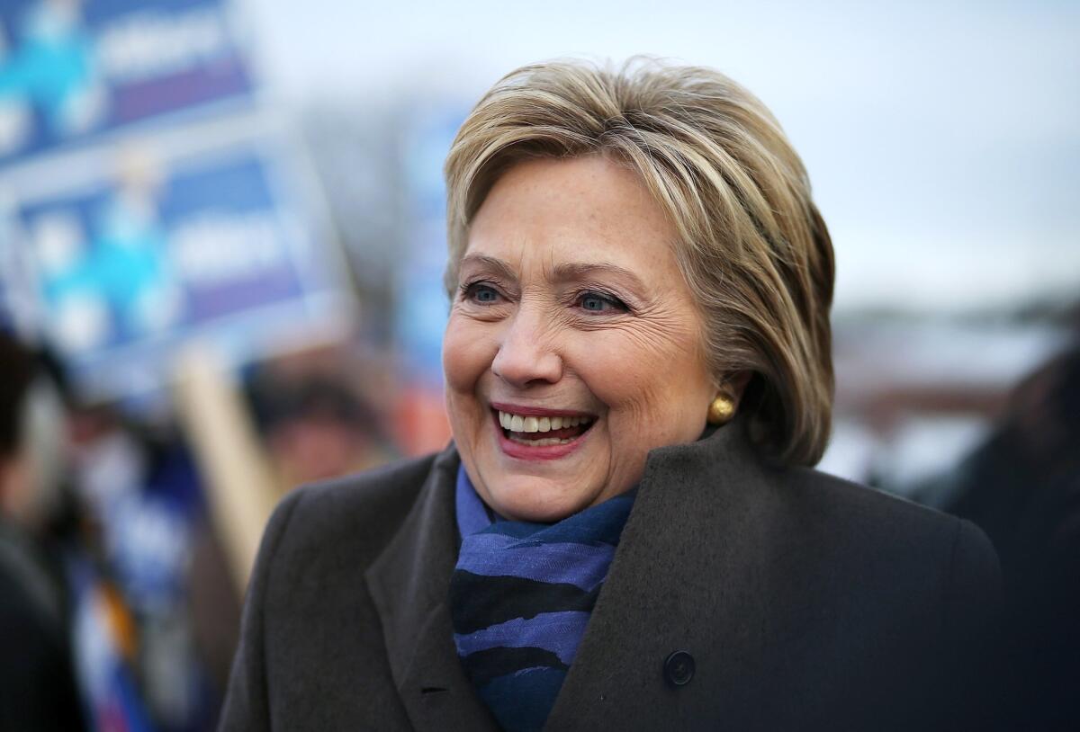 Democratic presidential candidate Hillary Clinton greets voters outside a polling station at Fairgrounds Junior High School on Tuesday in Nashua, N.H.