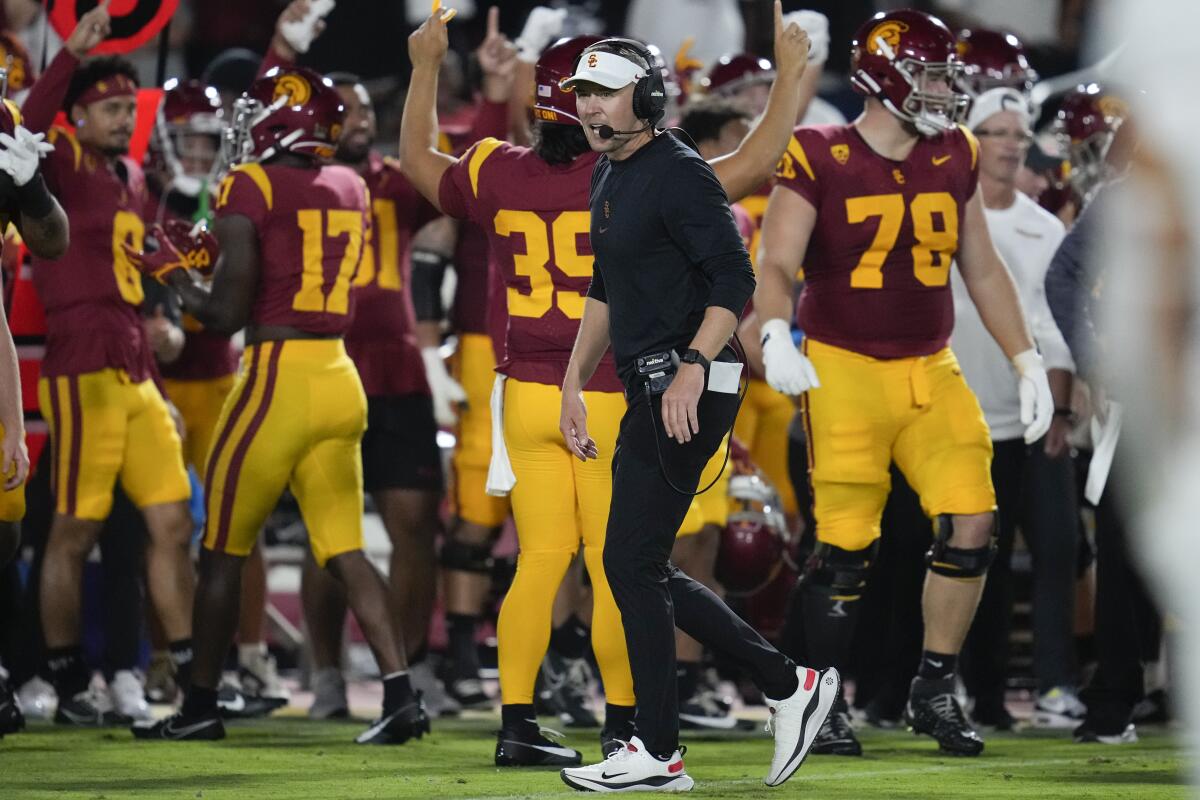 Southern California head coach Lincoln Riley walks on the sideline during the first half.