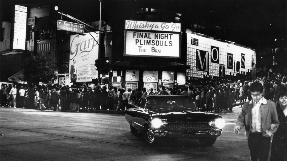 Crowds pack the sidewalk along Sunset Strip in 1982 as fans gather to hear the Plimsolls at the popular Whisky a Go Go.