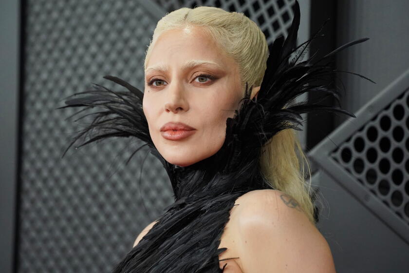 Image 9: FILE - Lady Gaga arrives at the 68th annual Grammy Awards on Sunday, Feb. 1, 2026, in Los Angeles. (Photo by Jordan Strauss/Invision/AP, File)