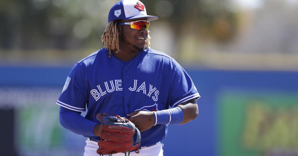 Los Angeles Angels' Vladimir Guerrero follows through on his three