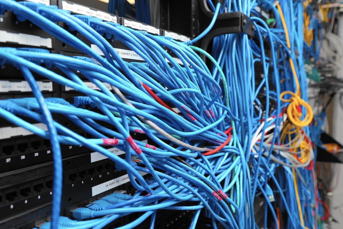 What the FCC has done is reclassify the Internet as a telecommunications service, rather than its former designation as an information service. Above, network cables are plugged into a server room.