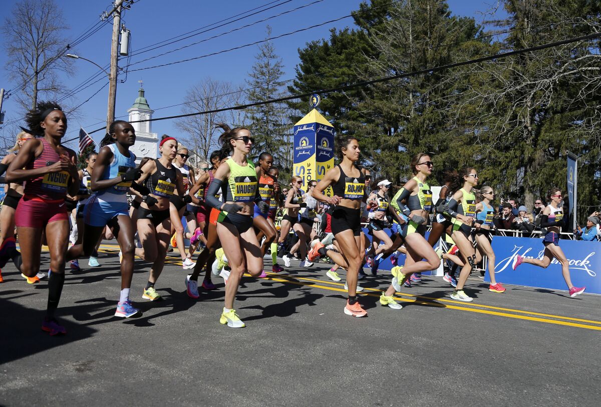 Women run in the 2022 Boston Marathon.