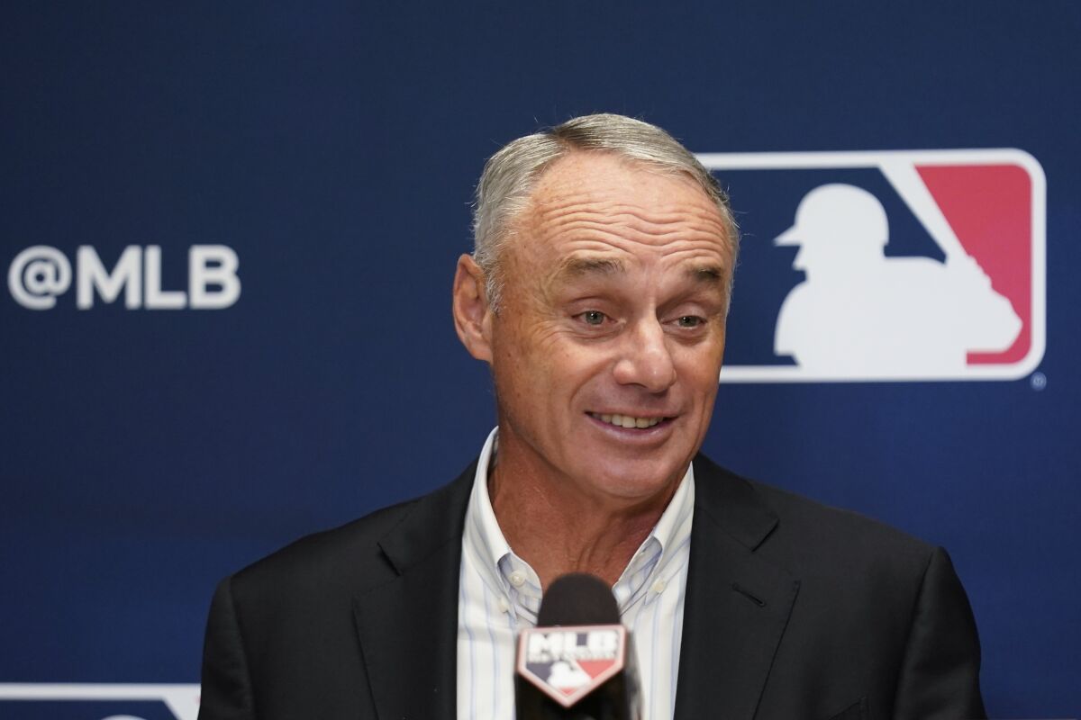 Major League Baseball Commissioner Rob Manfred speaks to reporters following an owners meeting.