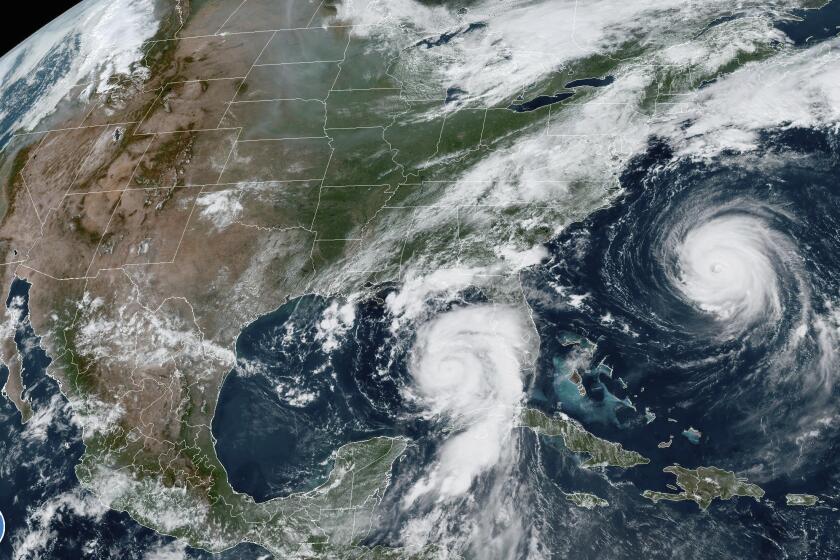 This Tuesday, Aug. 29, 2023, 1:31 p.m. EDT satellite image provided by the National Oceanic and Atmospheric Administration shows Hurricane Idalia, center, approaching Florida's Gulf Coast, and Hurricane Franklin, right, as it moves along the East coast of the United States, southwest of Bermuda. Feeding on some of the hottest water on the planet, Hurricane Idalia is expected to rapidly strengthen as it bears down on Florida and the rest of the Gulf Coast, scientists said. (NOAA via AP)