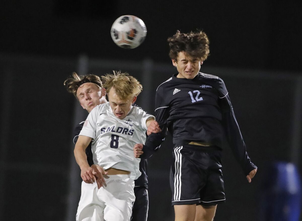 Newport Harbor's Nate Simmons, 8, and Corona del Mar's Ryan Peloso, 12, will battle for a throw-in on Monday.