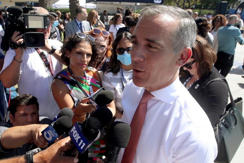 LOS ANGELES, CALIF. - JUL;Y 18, 2022. Los Angeles Mayor Eric Garcetti meets with reporters after announcing the dates for the 2028 Olympic and Paralympic Games in L.A., during a press conference at Exposition Park on Monday, July 18, 2022. (Luis Sinco / Los Angekles Times)