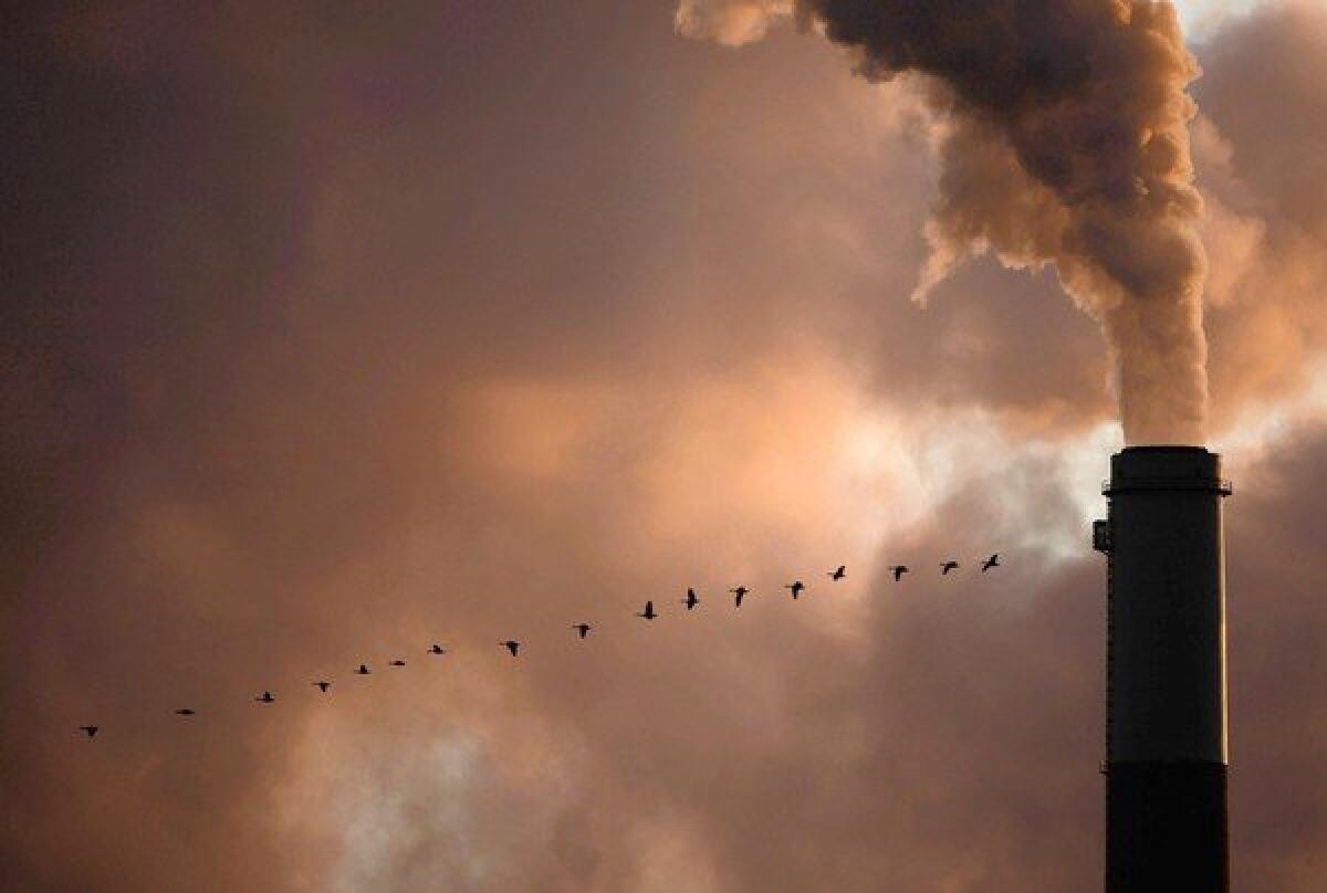 Smoke pours from the Jeffrey Energy Center coal power plant near Emmett, Kan. Coal-fired plants produce 29% of domestic greenhouse gas emissions, according to the Energy Information Administration.