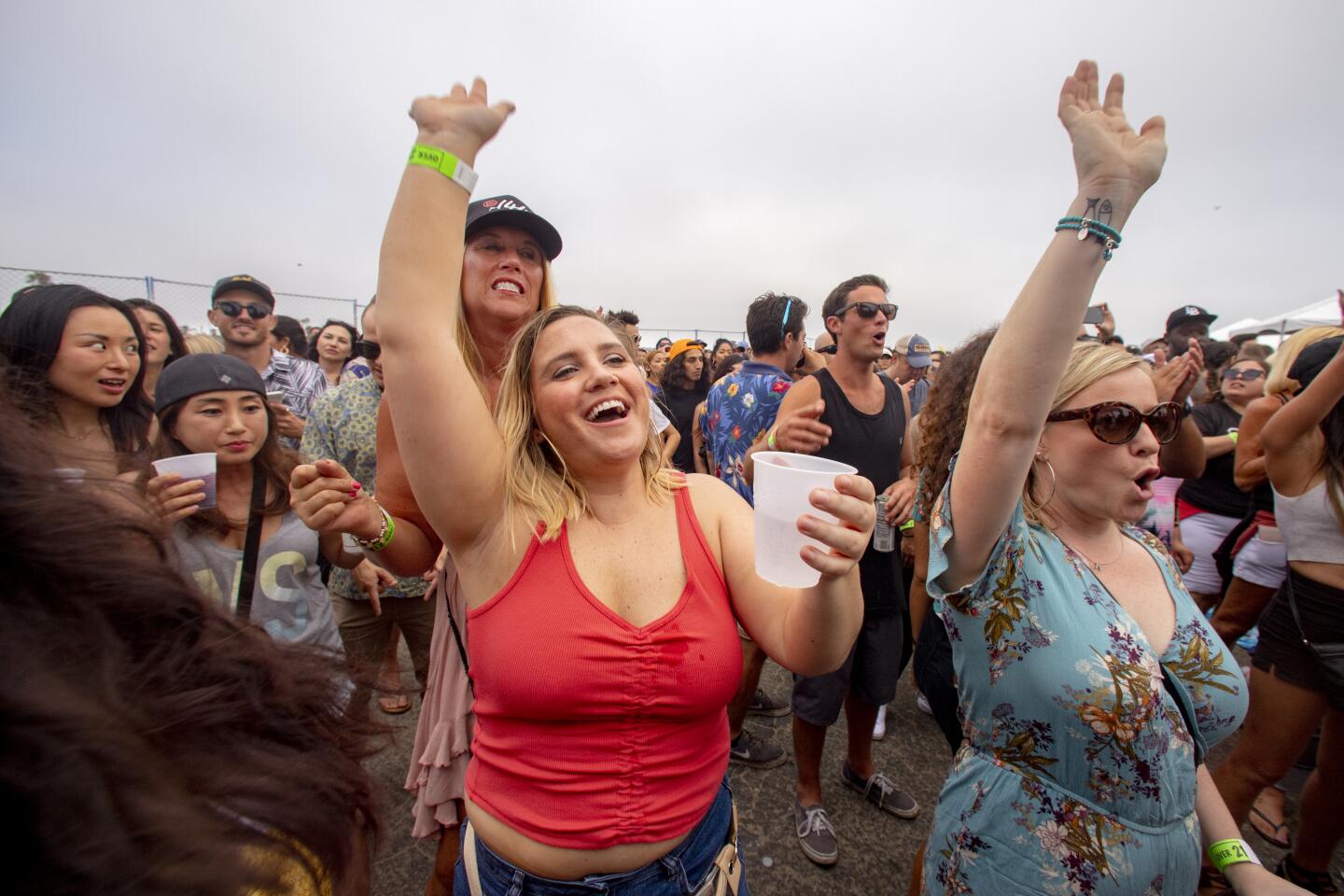 The crowd cheers as Snoop Dogg performs at DJ Snoopadelic at the Nood Beach festival Sunday at SeaLegs by the Beach at Bolsa Chica State Beach.