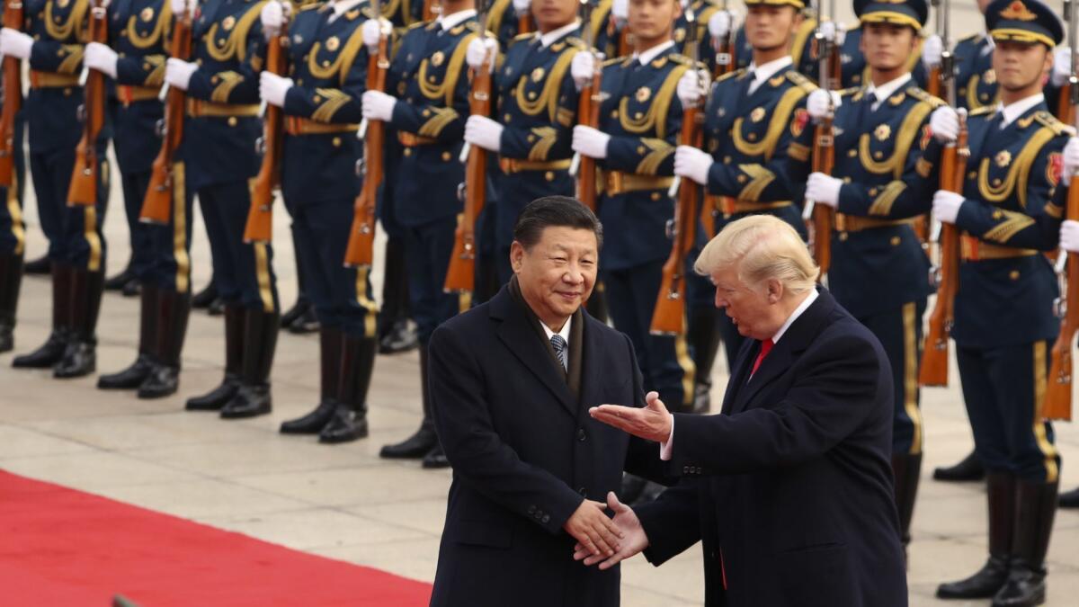 President Trump and Chinese President Xi Jinping participate in a welcoming ceremony at the Great Hall of the People in Beijing on Nov. 9, 2017.