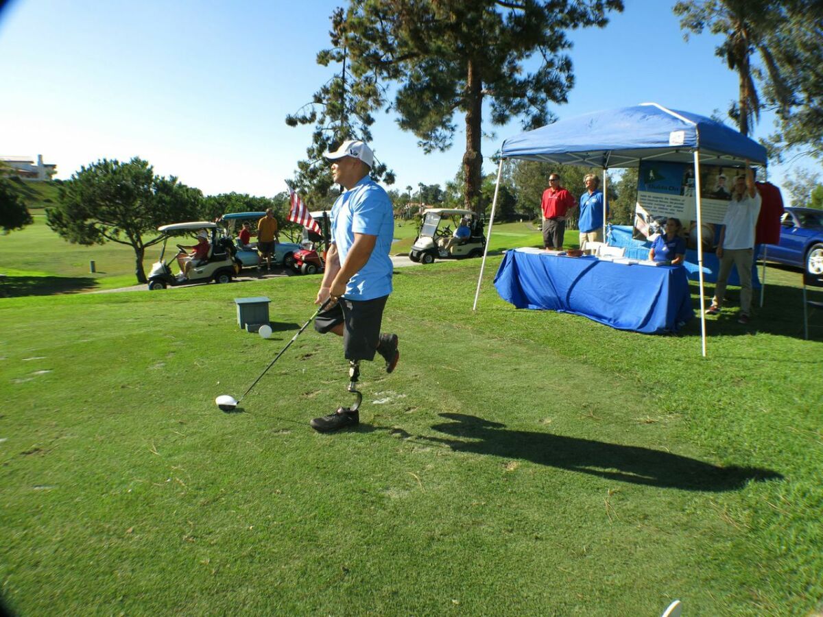 A military veteran enjoying the links during a Holes for Heroes tournament in 2014.