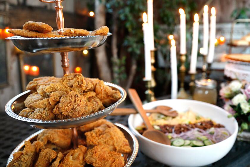 Three tiers of fried chicken -- and a salad -- are ready for the party to begin.