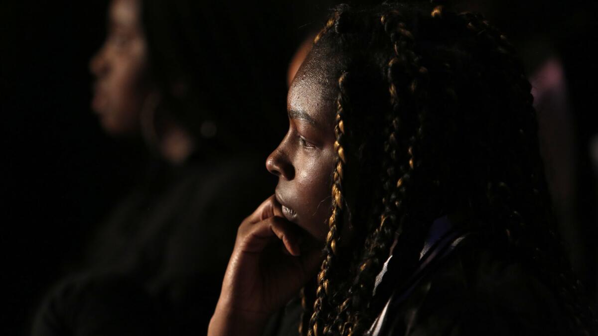 Zashaya Taylor, age 18, listen to the a discussion of the play "Time Alone" at the Pico Playhouse.