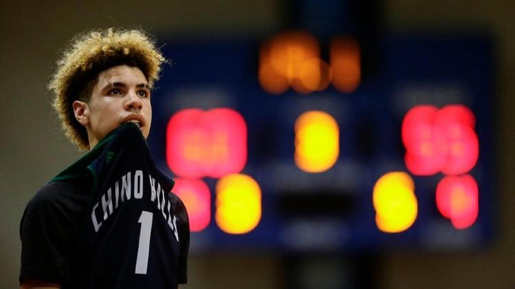 LaMelo Ball of Chino Hills bites on his jersey during a break in play.