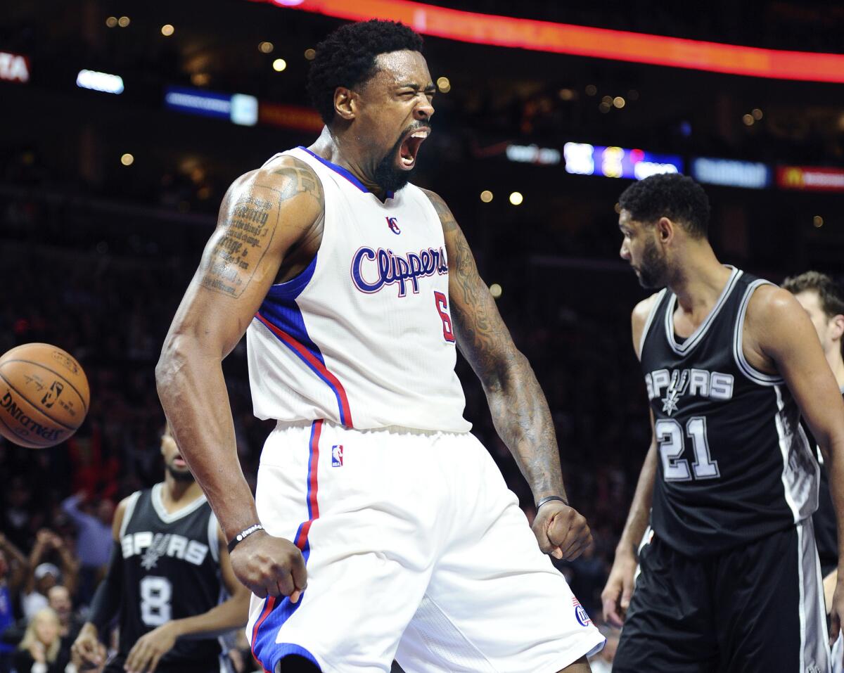 Clippers center DeAndre Jordan celebrates after dunking against the Spurs.