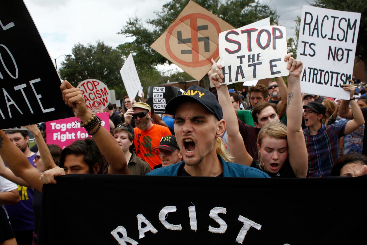 Protesters chant and hold signs at the site of a planned speech by white nationalist Richard Spencer on the University of Florida campus on Thursday.