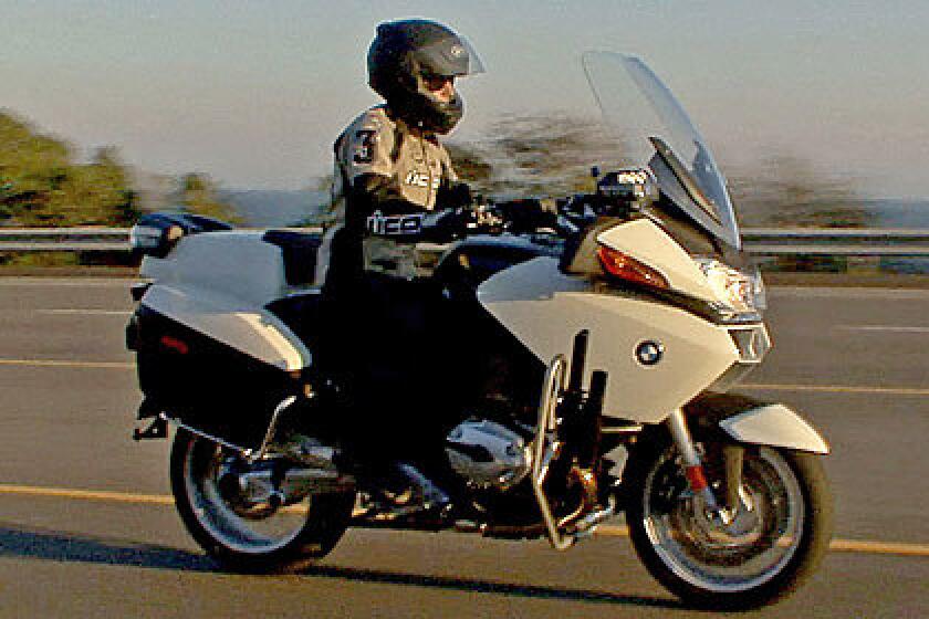 ON PATROL: Susan Carpenter takes a spin on the BMW R1200RT-P. The paint screams motorcycle cop.