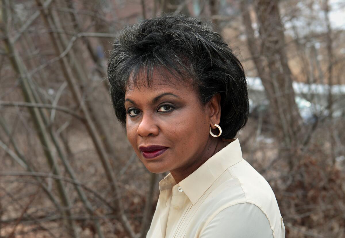 Attorney and Hollywood Commission President Anita Hill stands in front of a wooded background.