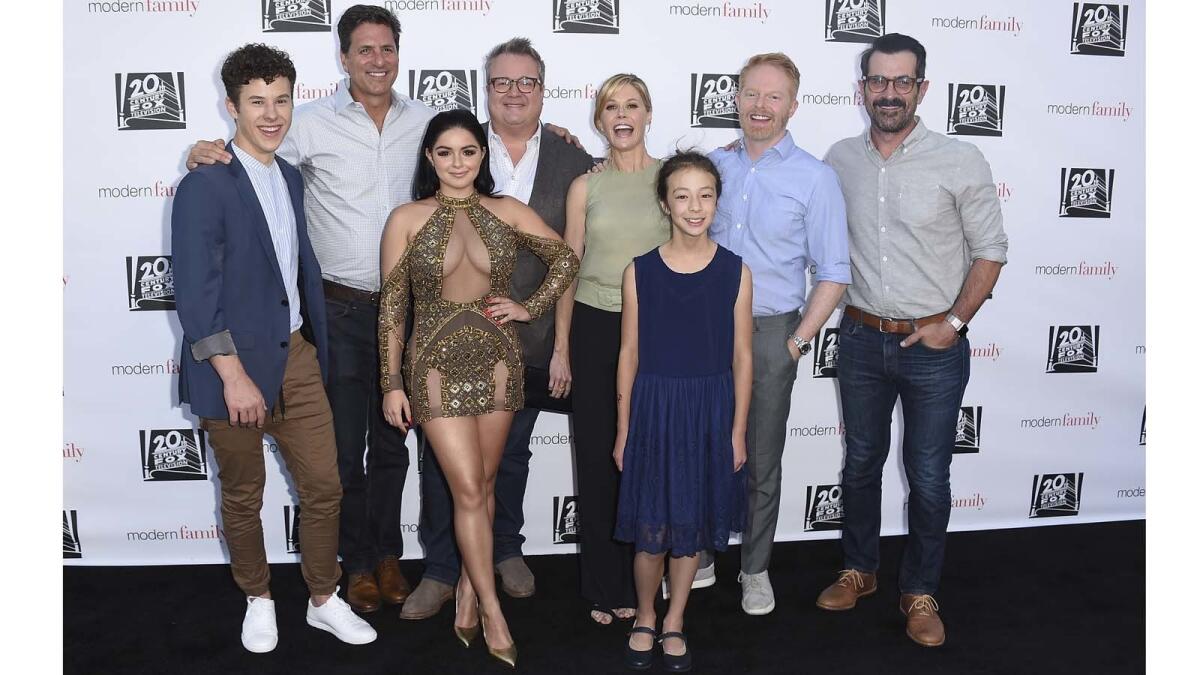 "Modern Family" cast members Nolan Gould, left, Steve Levitan, Ariel Winter, Eric Stonestreet, Julie Bowen, Aubrey Anderson-Emmons, Jesse Tyler Ferguson and Ty Burrell.