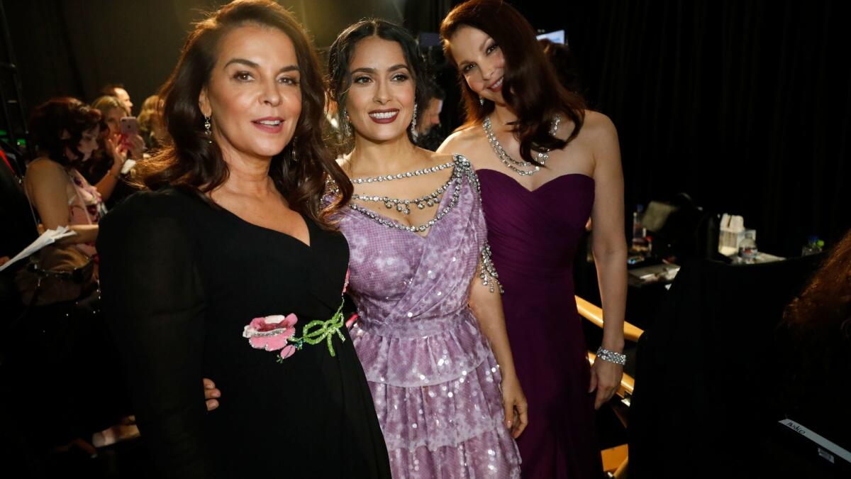 Annabella Sciorra, from left, Salma Hayek and Ashley Judd prepare to speak their piece at the Academy Awards.