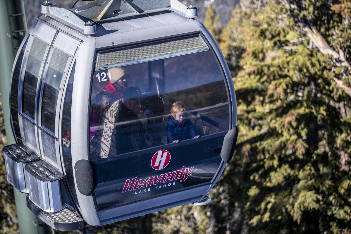 Visitors ride the gondola at Heavenly Ski Resort