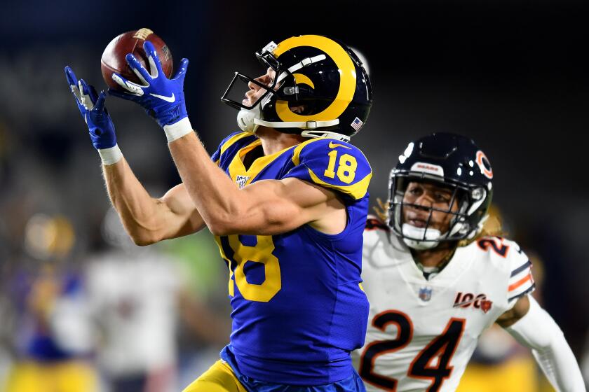 LOS ANGELES, NOVEMBER 17, 2019-Rams receiver Cooper Kupp cacthes a long pass in front of Bears defensive back Buster Skrine setting up a touchdown in the 2nd quarter at the Coliseum Sunday. (Wally Skalij/Los Angerles Times)