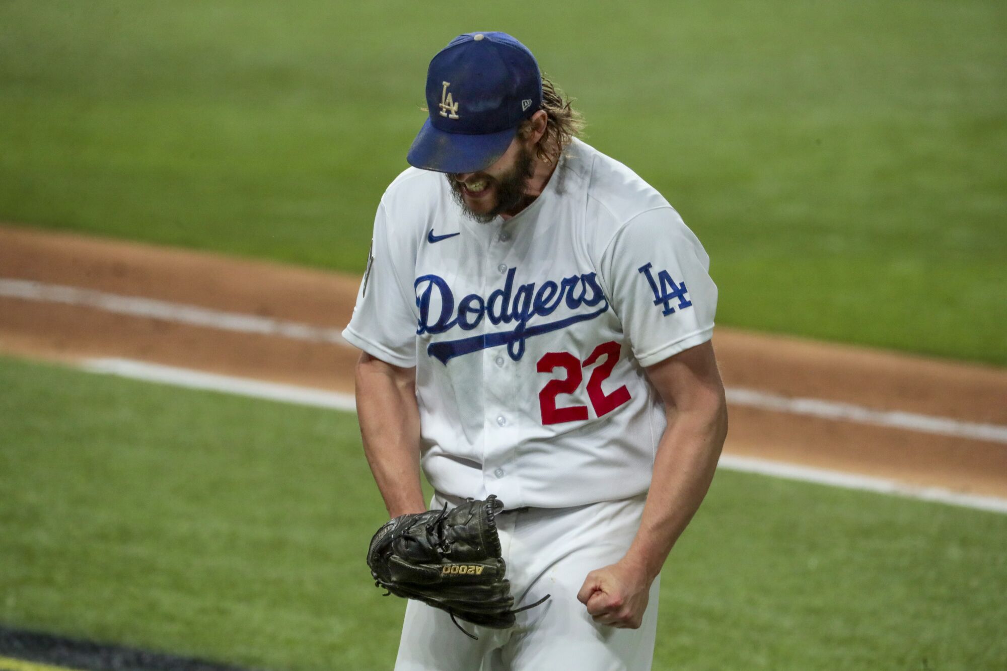 Dodgers starting pitcher Clayton Kershaw yells out in frustration as he heads to the dugout.