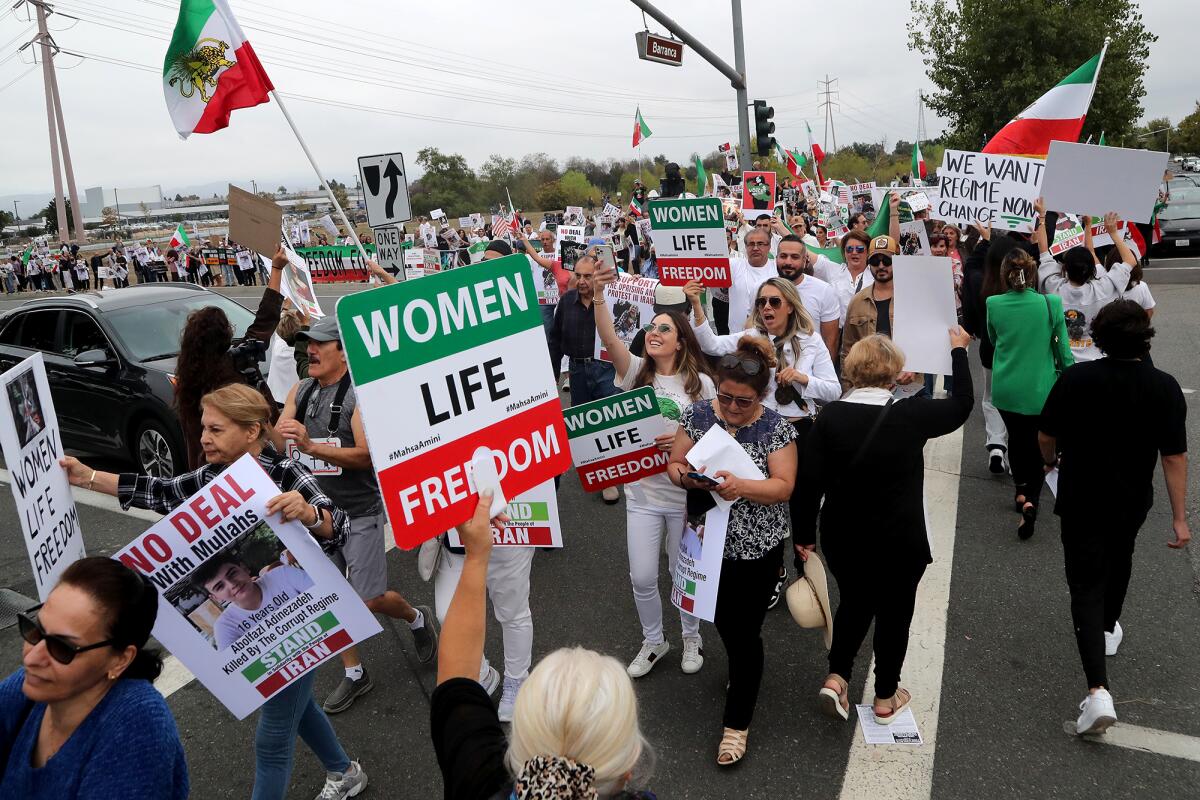Demonstrators show their support for a free and democratic Iran during President Joe Biden's visit to Irvine on Friday.