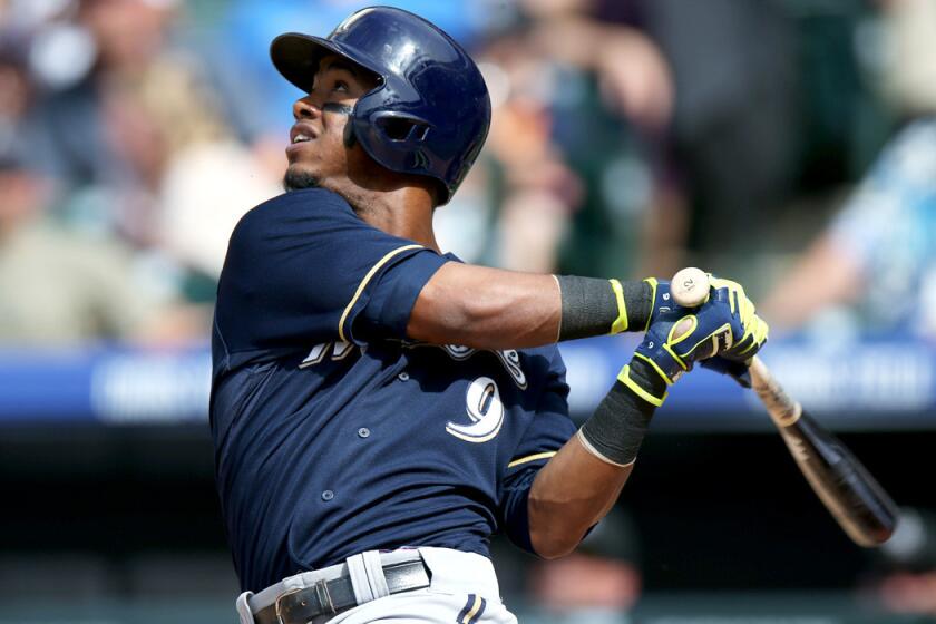 Brewers shortstop Jean Segura flies out against the Colorado Rockies in the fifth inning of a game last month in Denver.