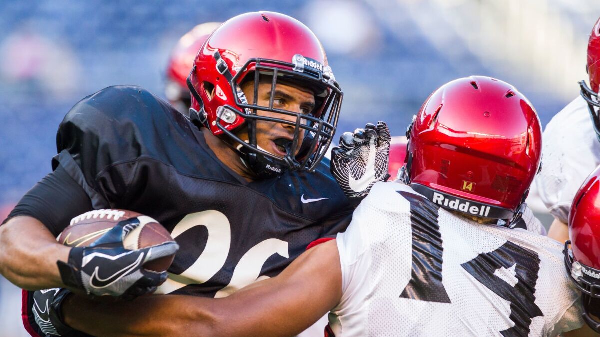 San Diego State redshirt freshman running back Kaegun Williams (left) produced the only touchdown of Saturday's scrimmage, scoring on a 56-yard run.