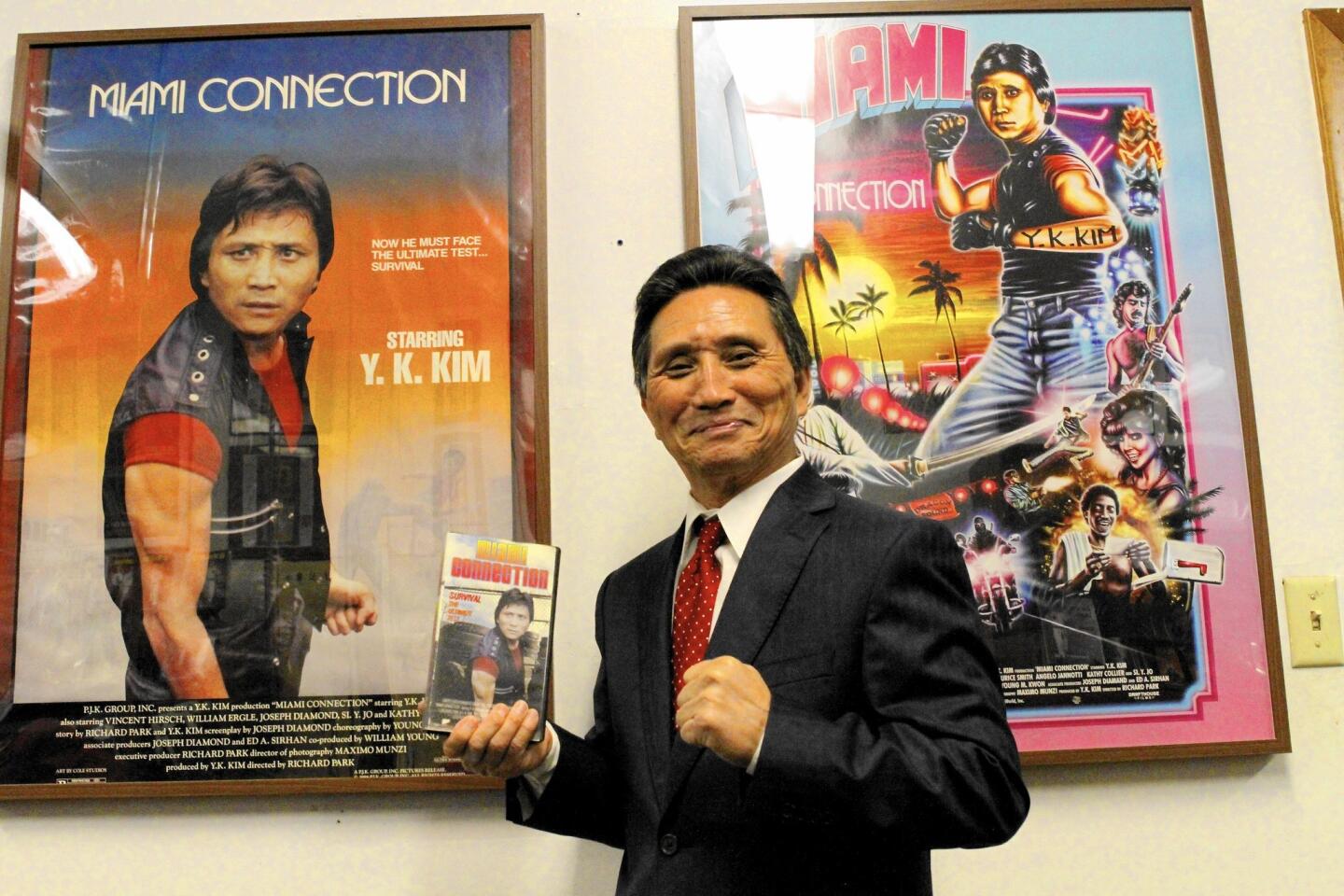 Y.K Kim holds an original VHS copy of his 1987 action movie “Miami Connection.”