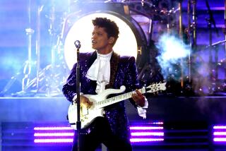 LOS ANGELES, CA - FEBRUARY 12: Recording artist Bruno Mars performs onstage during The 59th GRAMMY Awards at STAPLES Center.