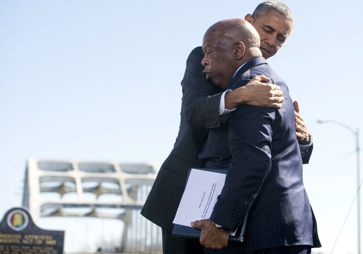 President Obama hugs U.S. Rep. John Lewis (D-Ga.), one of the original 1965 marchers in Selma, at an event marking the 50th anniversary of what became known as Bloody Sunday.