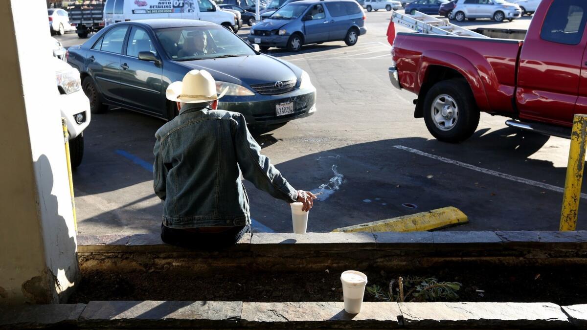 David, 70, who lives in his vehicle, has a cup of coffee Wednesday morning on West 19th Street near Placentia Avenue in Costa Mesa during Orange County's 2019 Point in Time homeless count.