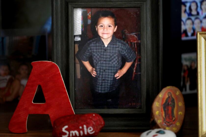 CALIFORNIA CITY, CALIF. -- FRIDAY, AUGUST 2, 2019: A photo of Anthony Avalos, taken in 2013 at the age of six-years-old, at the home of David and Maria Barron in California City, Calif., on Aug. 2, 2019. The Barrons are the aunt and uncle of Anthony Avalos. Between February, 2013, and November, 2016, the county’s child abuse hotline received at least 13 calls related to Anthony Avalos, a 10 year-old Lancaster boy. Then, on June 20, 2018 he was found unresponsive in his family's apartment. He died the next day, June 21, 2018. (Gary Coronado / Los Angeles Times)